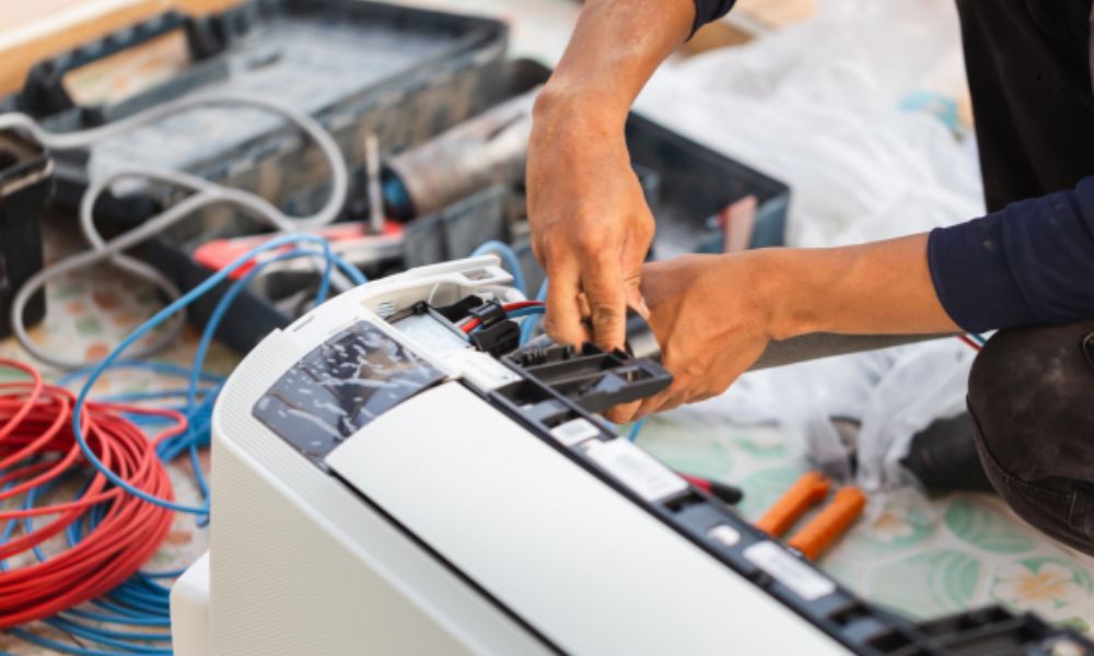 Certified technician inspecting industrial heat exchange unit
