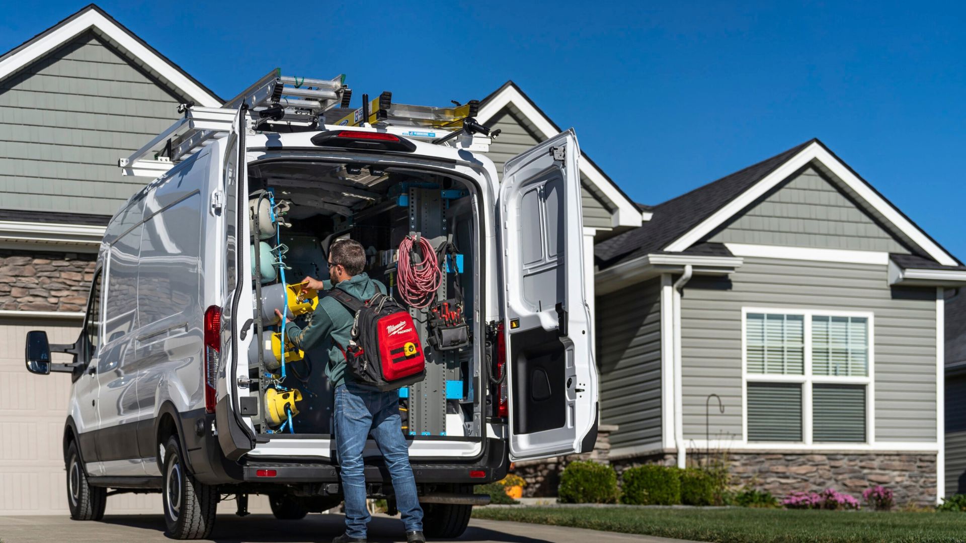 HVAC Technician servicing modern high-efficiency outdoor heat pump unit